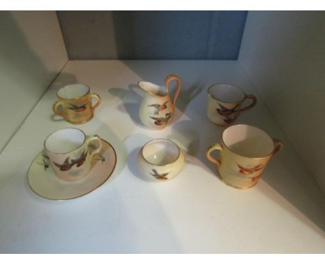 A Royal Worcester G &amp; Co. miniature part teaset decorated with birds in flight a/f 