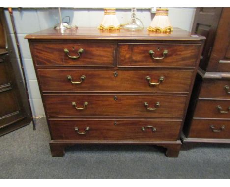 A George III mahogany chest of two short over three long drawers, brass swan neck handles, on bracket supports, 101cm high x 