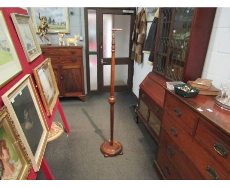A wooden standard lamp 