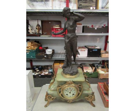 An onyx and brass French clock ca. 1880, spring driven movement signed Japy et Cie, striking on bell. Clock surmounted by cas