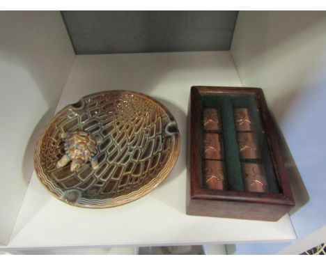 A boxed set of 1930's copper plated napkin rings depicting deer and a Wade tortoise ashtray 