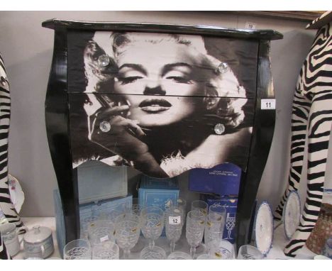 A 2 drawer chest depicting Marilyn Monroe.