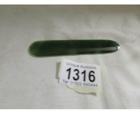 A jade bookmark/page turner.