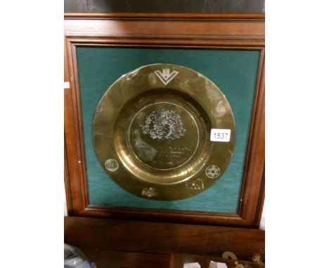 A presentation brass plaque in mahogany frame.
