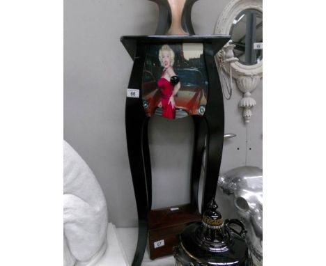 A modern stand with drawers depicting Marilyn Monroe.