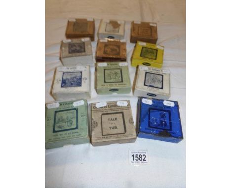 12 boxed sets of lantern slides being Russo Japanese war, Elephant's Revenge, Comical cats & dogs, Robin Hood, India, The Thr