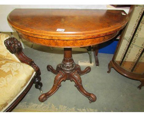 A Victorian walnut veneered 'D' end fold over card table.