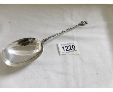 A silver anointing spoon with Lincoln imp finial, Birmingham 1911/12, Approximately 56 grams.