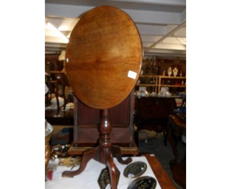 An oak tripod table.