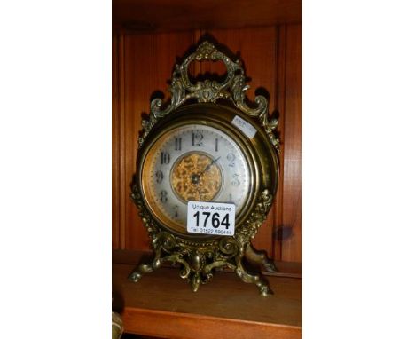 An Edwardian brass mantel clock.