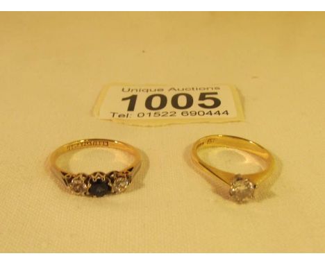 An 18ct gold solitaire ring size K and an 18ct gold ring set with sapphire and 2 diamonds, size M