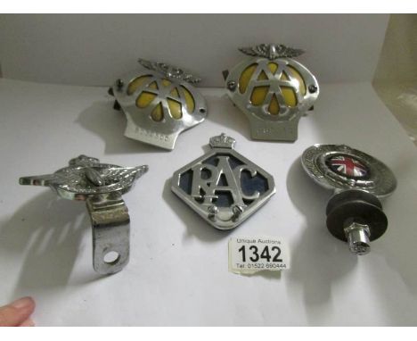 A Royal Automobile Club Association car badge, a civil service car badge, 2 AA badges and an RAC badge.