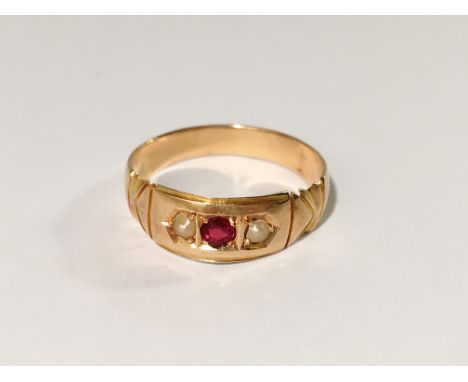 A ruby and pearl set ring in 18ct gold, dated Birmingham 1890, size L.