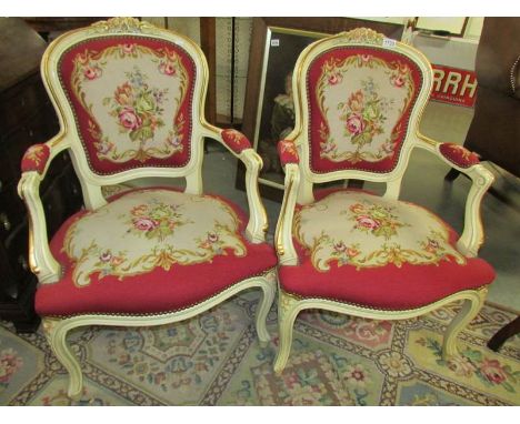 A pair of salon chairs with tapestry seats and backs.