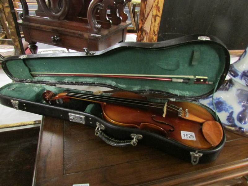 A violin and bow in case.