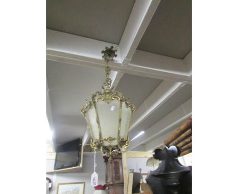 A brass hall lantern with etched panels.