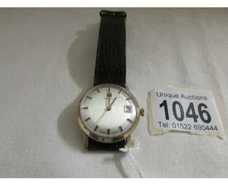 A 1970's Tissot Gentleman's gold wrist watch inscribed to rear 'D.W.Lee, Kelly's Directories Ltd., 25 years service' (with in