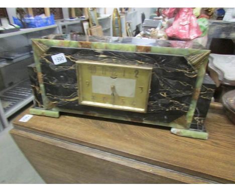 An art deco marble mantel clock.