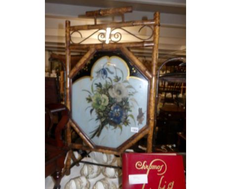 A bamboo framed fire screen, glass a/f.