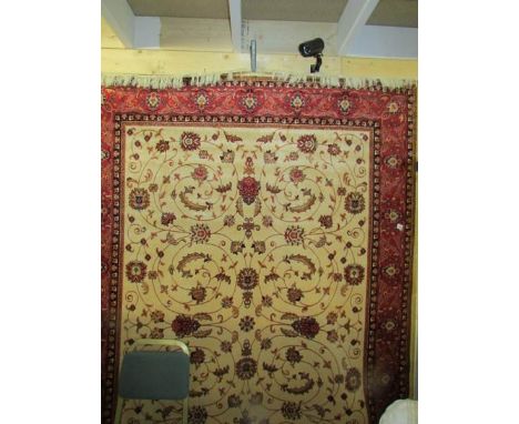 A beige ground Keshan carpet.