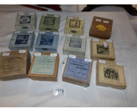 12 boxed sets of magic lantern slides being Sweep & White Washer, A frog he would a wooing go, comical cats and dogs, America