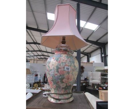 A pottery table lamp with shade.