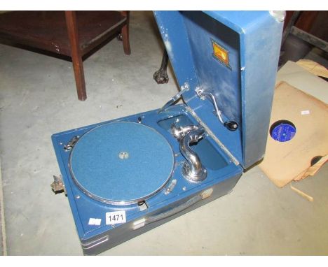 An exceptional HMV portable record player working and in good condition plus 78 rpm records.