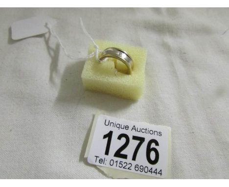 A Diamond set yellow and white gold ring, size K.