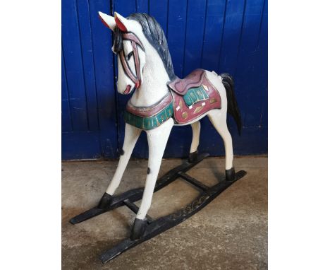 Hand painted carved wooden child's rocking horse.  (B.P. 21% + VAT)