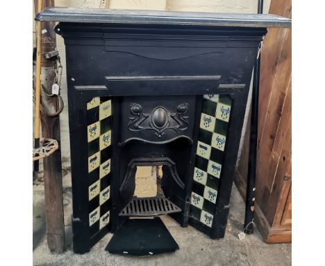 Art Nouveau cast iron fireplace, with organic design tiles. (B.P. 21% + VAT)Dimensions - 90x17x118cm approx. Some of the tile