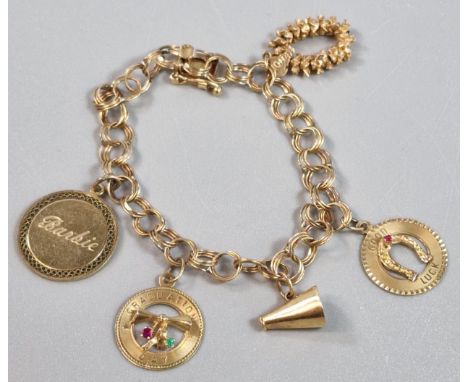 14K curb-link charm bracelet, with assorted charms including: lucky horseshoe, Mary and Barbie pendant etc. 17.6g approx. (B.