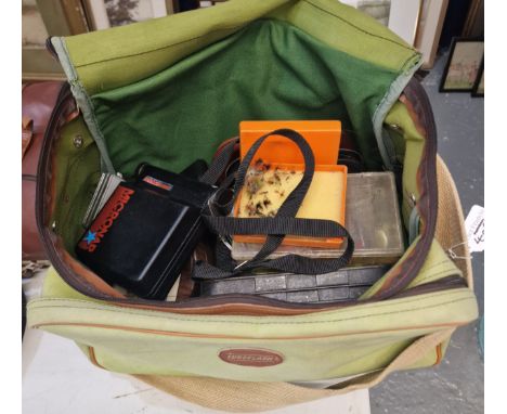 Canvas fisherman's bag containing a large collection of lures, flies and other items in boxes and cases. (B.P. 21% + VAT)