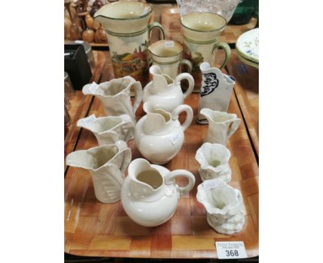 Collection of ceramics to include: graduated set of Doulton cylinder pincher jugs depicting countryside scenery, collection o