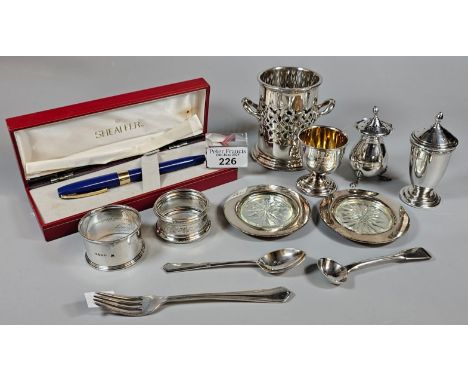 Collection of silver and some silver plated items to include: napkin rings, pepperettes, teaspoon, christening egg cup etc. T