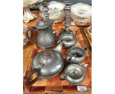 Manor Period, a four piece beaten pewter teaset, together with a Tudric Pewterware two handled beaten sugar bowl and pair of 