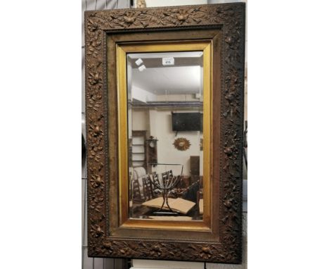 Late 19th century gilt framed bevel plate mirror with relief floral and foliate frame gilt slip. 84x53cm approx. (B.P. 21% + 