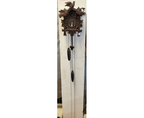 Mid century carved wooden, probably Bavarian, cuckoo clock, with chains and cone weights. (B.P. 21% + VAT)
