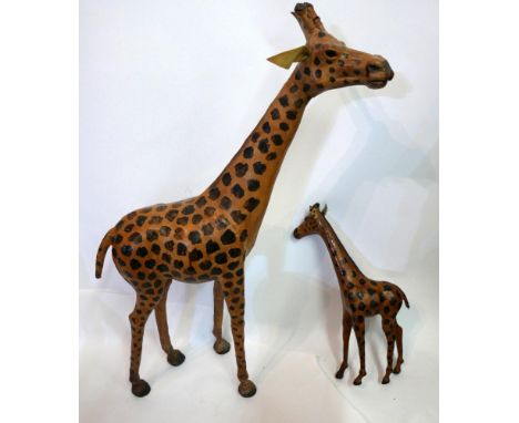 A vintage leather giraffe, H.87cm, together with a vintage leather baby giraffe, H.45cm 
