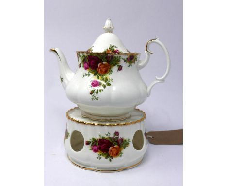 A Royal Albert bone china teapot and matching teapot stand in the Country Roses pattern, with gilded rims, teapot H.16.5 W.22