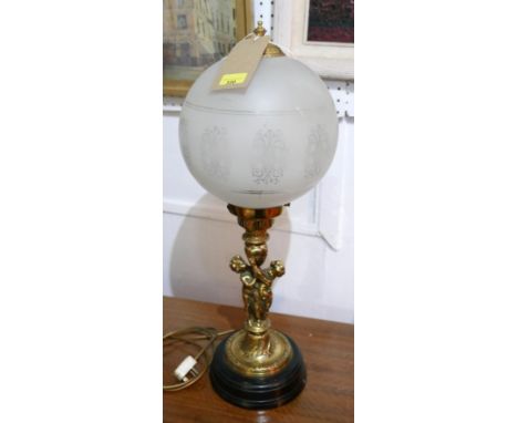 A 20th Century table lamp with etched glass globe shade on an ormolu stem with cherubs, H.70cm 