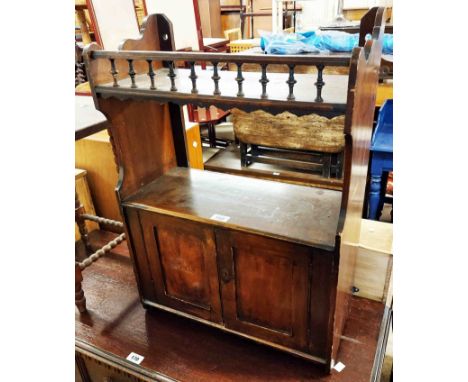A 51cm late Victorian walnut wall hanging cabinet with spindle set shelf to top over a pair of panelled doors