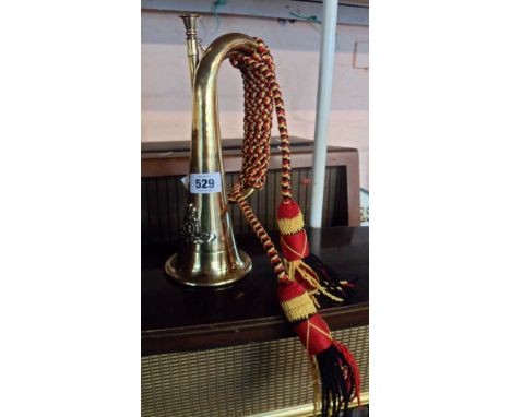 A modern brass regimental bugle