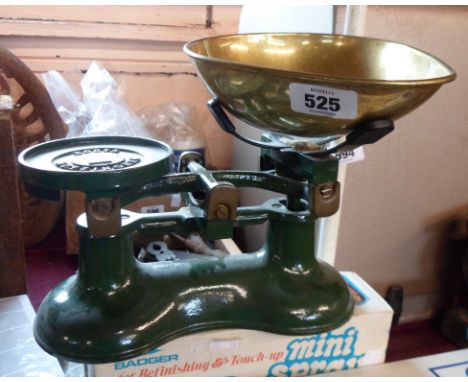 A set of modern cast iron kitchen scales with brass fittings and pan
