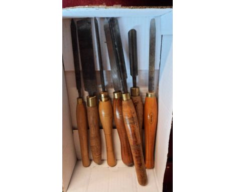 A box containing seven old turning chisels of various makers including Marples, Crown Tools, etc.