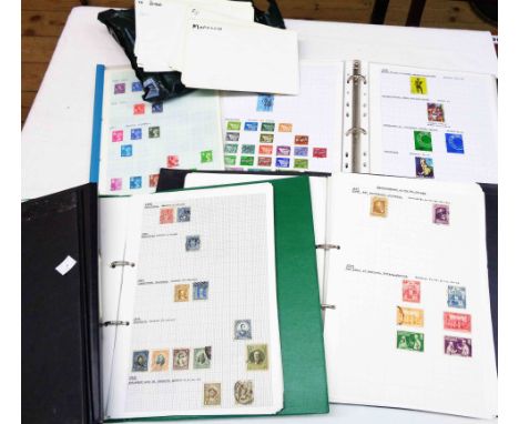 A ring bound album containing mainly 20th Century hinge mounted world stamps, also three late Victorian Straits Settlements e