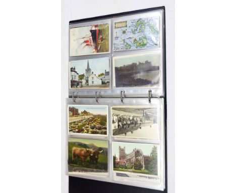A burgundy ring bound album containing a collection of early 20th Century and other postcards including numerous sepia topogr