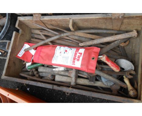 An old wooden box containing a quantity of assorted tools including hammers, files, spanners, etc.