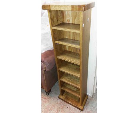 A pair of modern solid oak seven shelf open CD racks
