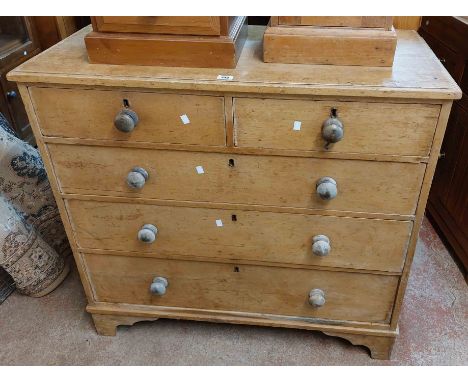 A 1.1m Victorian pine chest of two short and three long graduated drawers, set on bracket feet - for re-polishing