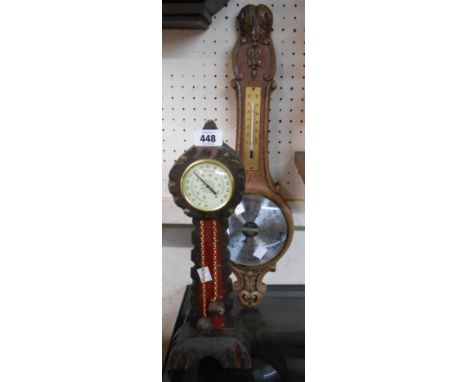 A small freestanding carved soft wood longcase style aneroid barometer - sold with an oak effect resin cased Weathermaster ba